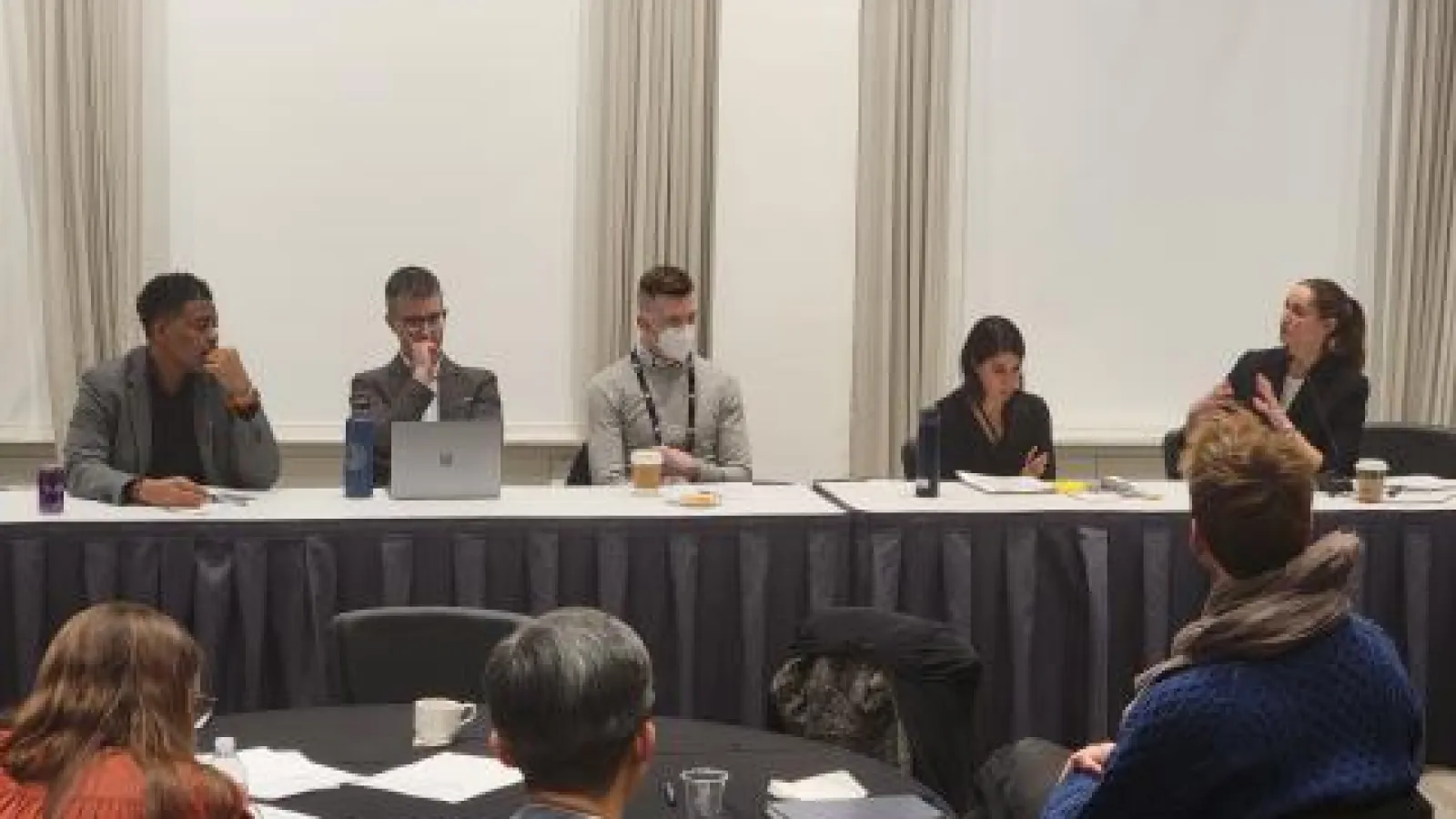 Panelists sitting